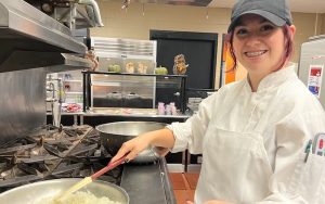 A Somerset County Vocational and Technical High School culinary student practices how to sauté in the school’s onsite restaurant, Trade Wins. 