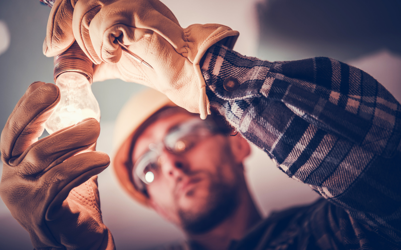 Man fixing a light bulb