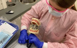 Ayesenur Turkmenoglu, a dental occupations student at Burlington County Institute of Technology, applies what she learns in her customized high school classroom directly to her job at a dentist office.