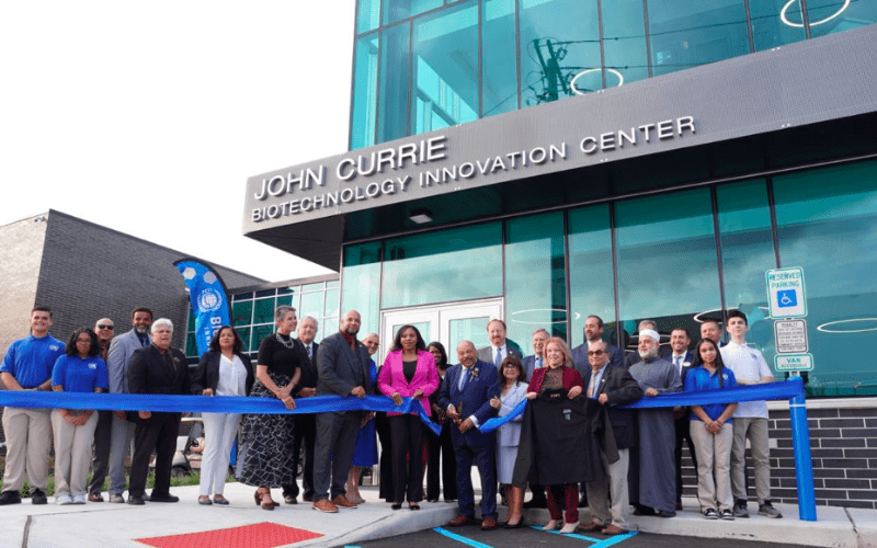 Chairman John Currie is joined by Lt. Gov. Tahesha Way and dignitaries to cut the ribbon for the new learning facility.