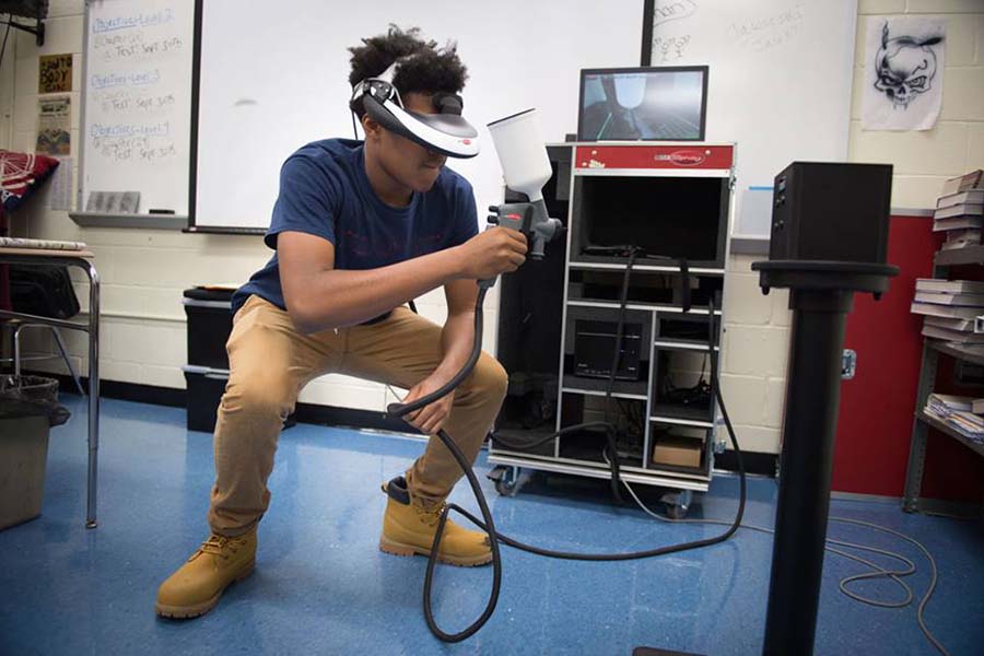 A student uses virtual technology as part of BCIT’s automotive collision training.