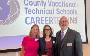 Judy Savage (pictured center) receives the CTE Leadership Award from New Jersey Council of County Vocational-Technical Schools Executive Director Jackie Burke (pictured left) and Council President James Pedersen, Ed.D. (pictured right).