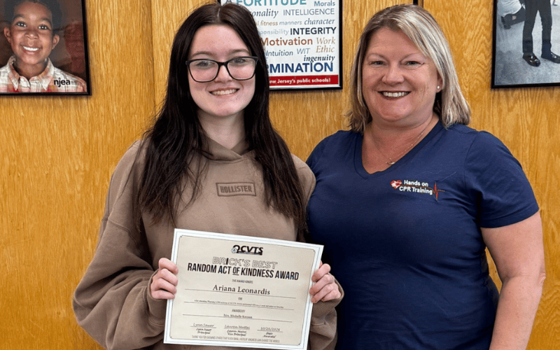 Tuckerton Student standing with Teacher with random acts of kindness award