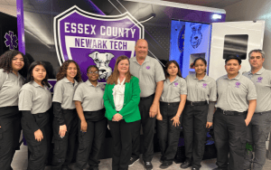 Essex County Schools of Technology trains students in an EMT program, with support from an ambulance simulator and in-hospital training opportunities thanks to local partnerships. Pictured with students are Dr. Cathleen DelaPaz, director of Career and Technical Education and Academies for ECST (center) and John Dolan, director of Adult, Career and Technical Education for ECST.