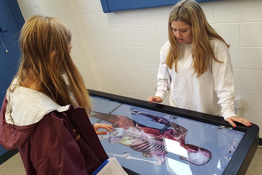 Hunterdon County students use an anatomage table to learn the human body.
