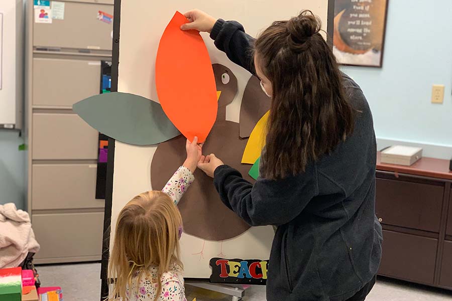 Hunterdon County high school students decorate for Thanksgiving at the on-campus laboratory preschool.