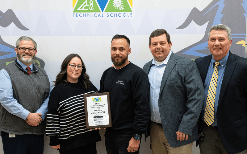 Mercer County Technical Schools honored alumni Ashley and Angel Bodon (pictured center) for February's CTE Month in recognition of their success building a thriving business as owners and operators of three Chris' Auto Body shops.