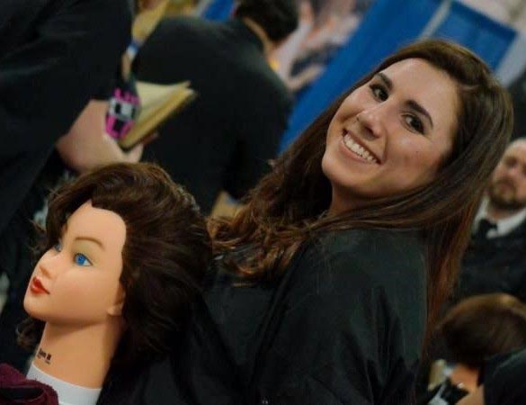 A Mercer county cosmetology student practices on a mannequin
