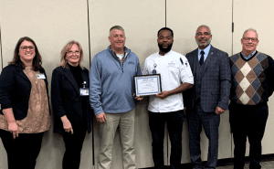 Seabrook Village Executive Chef Talib Mohammed accepts the 2023 Business Partner of the Year Award from Monmouth County Vocational School District on behalf of the senior living community.