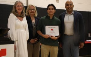 Aditya Mahalingam, center, a recent graduate of Morris County Vocational School District, received one of the VMware $1,000 scholarships through the NJAC Foundation. Joining him is Jay Singh, client director for VMware, right, Morris County Commissioner Deborah Smith, far left, and MCVSD Board President Barbara Dawson. 