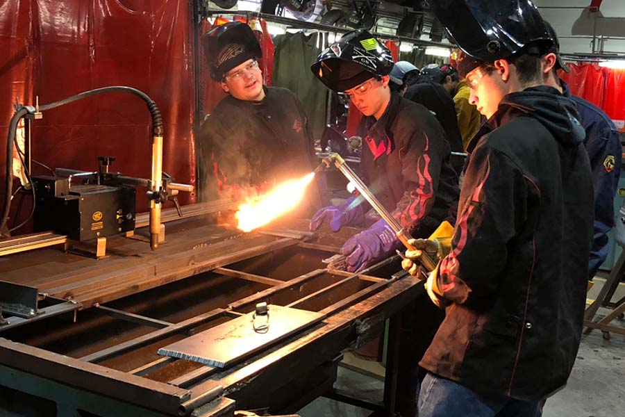 Morris County students take turns practicing welding.