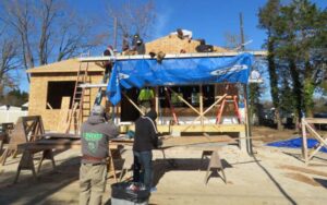 Adult students with the Ocean County Vo-tech’s New Home Construction program work on a Habitat for Humanity house