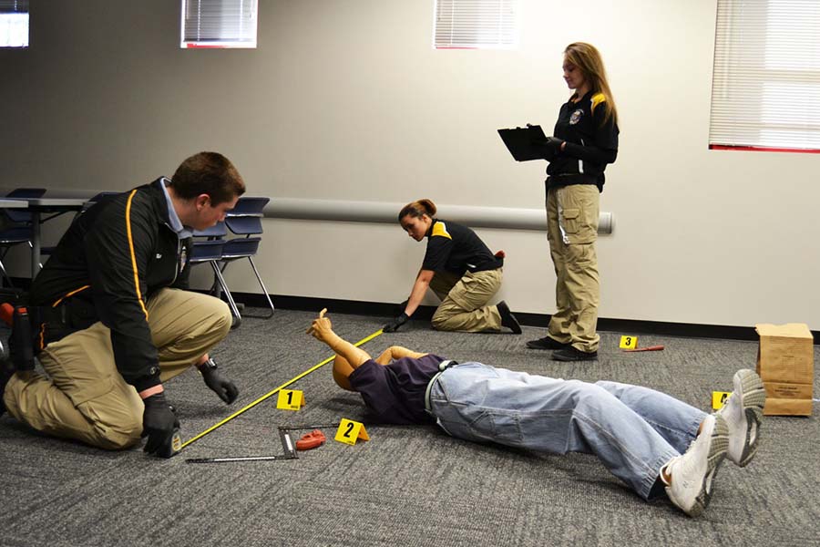 Ocean County students walk through a crime scene investigation.