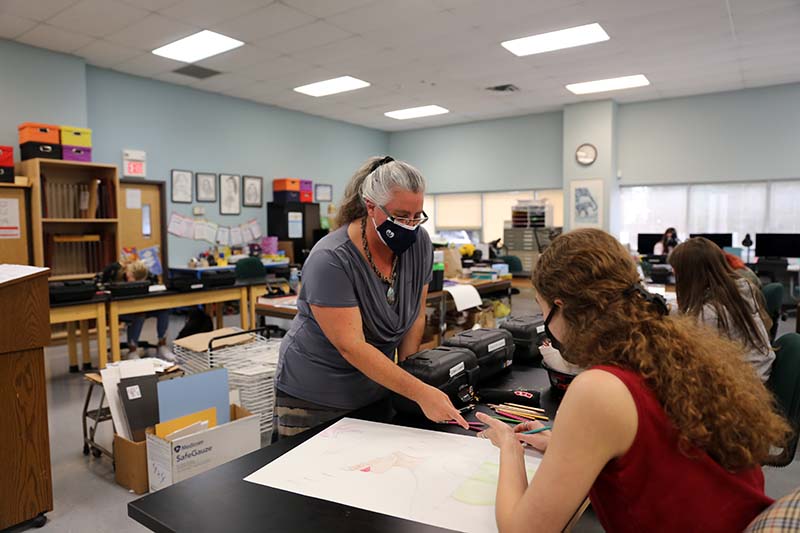 Hunterdon County Teacher of the Year Teresa Diaz reviews commercial arts projects
