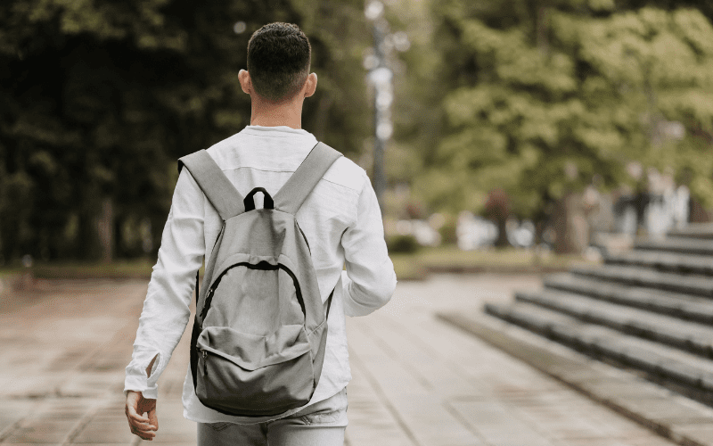 Student walking away with backpack on back