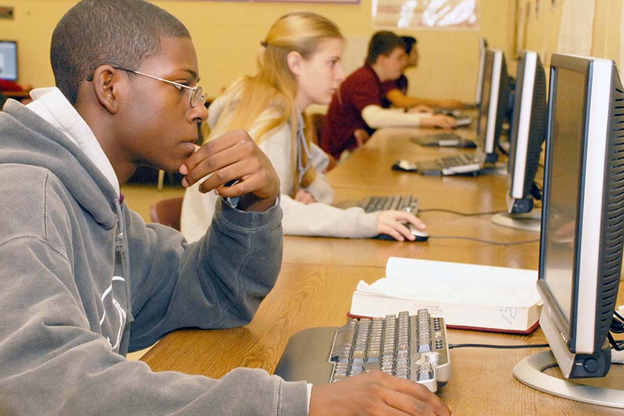 Salem students use desktop computer in a classroom.